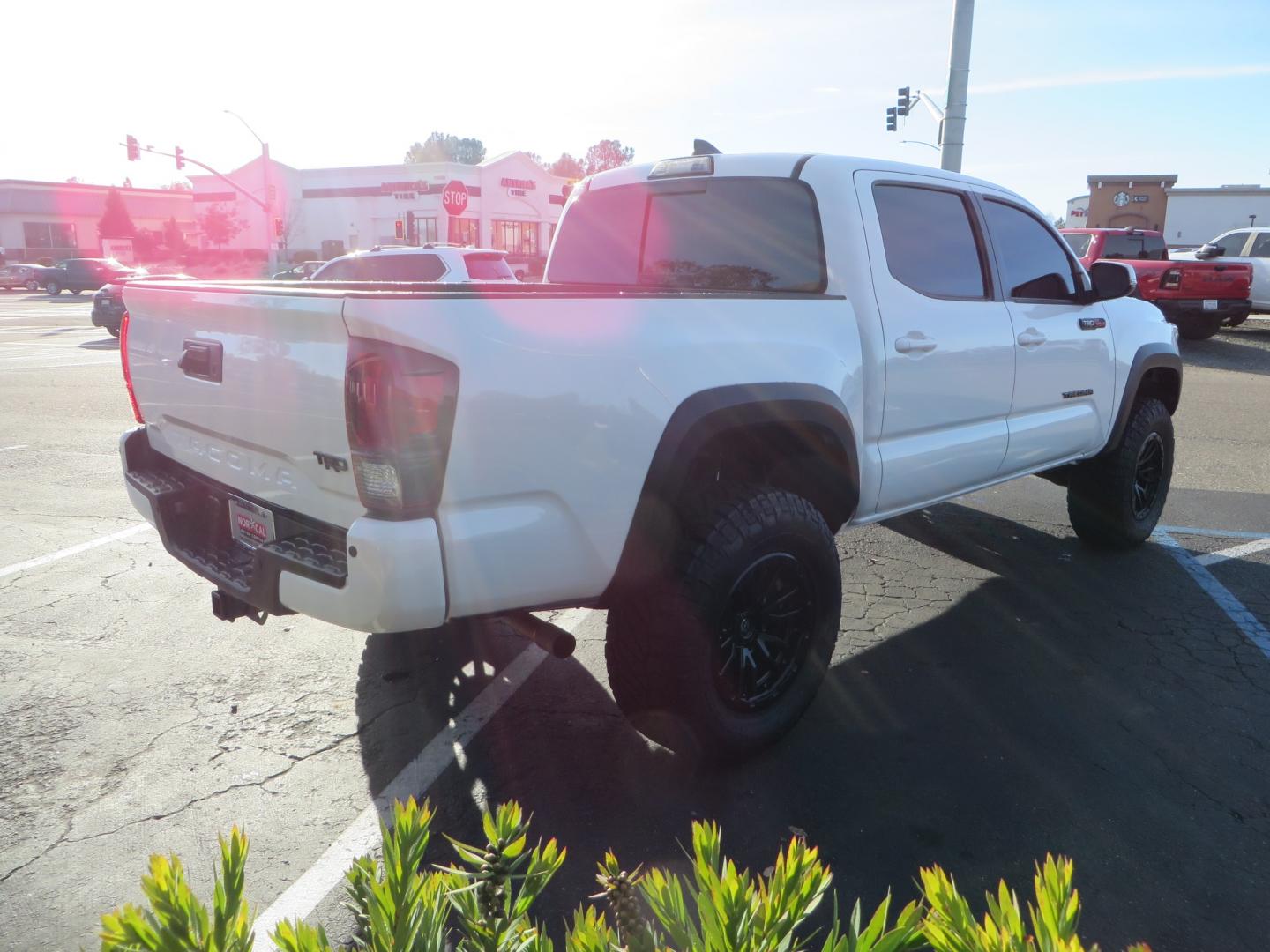 2019 White /black Toyota Tacoma TRD OFF-ROAD Double Cab (3TMAZ5CN4KM) with an 3.5L engine, automatic transmission, located at 2630 Grass Valley Highway, Auburn, CA, 95603, (530) 508-5100, 38.937893, -121.095482 - TRD Offroad 2WD sitting on Fox 2.5 remote reservoir DSC Coil-overs, Total Chaos upper control arms, Rigid Industries Dually side shooter leds, Fuel Rebel wheels, Nitto Ridge Grappler tires, and window tint. - Photo#4